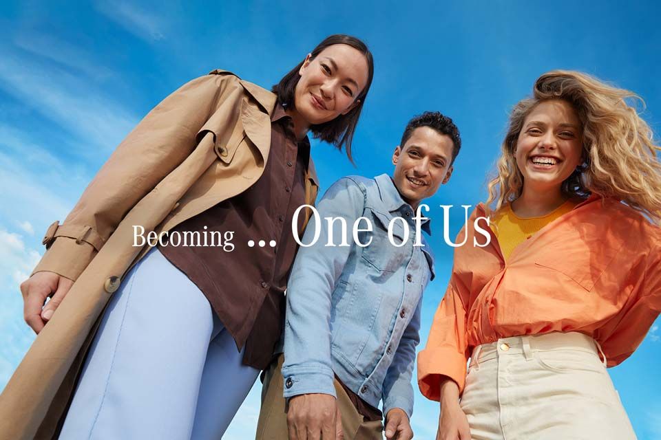Group of young people against a blue sky